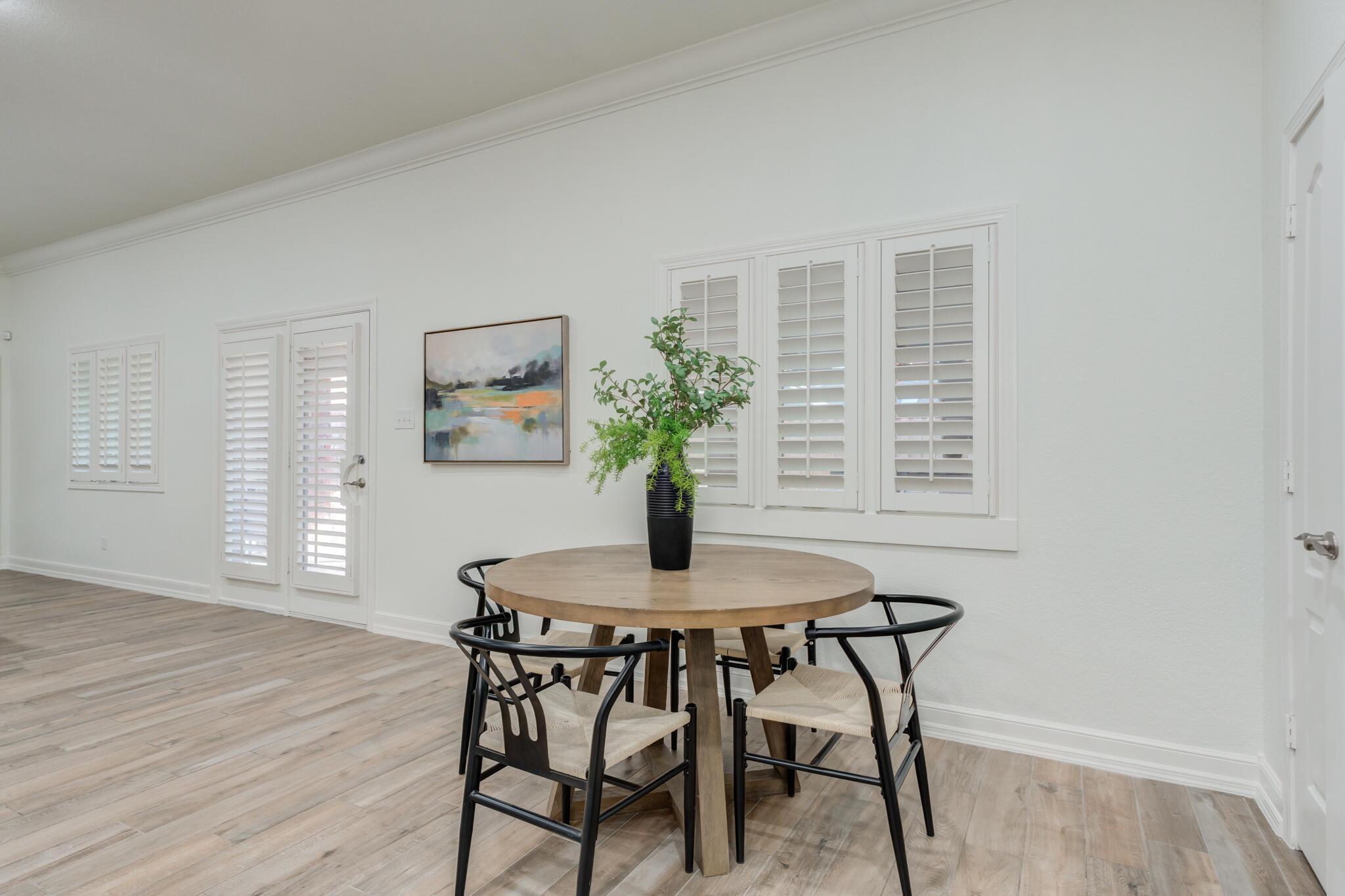 4707 85th Street Lubbock, TX 79424 - Photo 30 of 63 a dining room with furniture and wooden floor