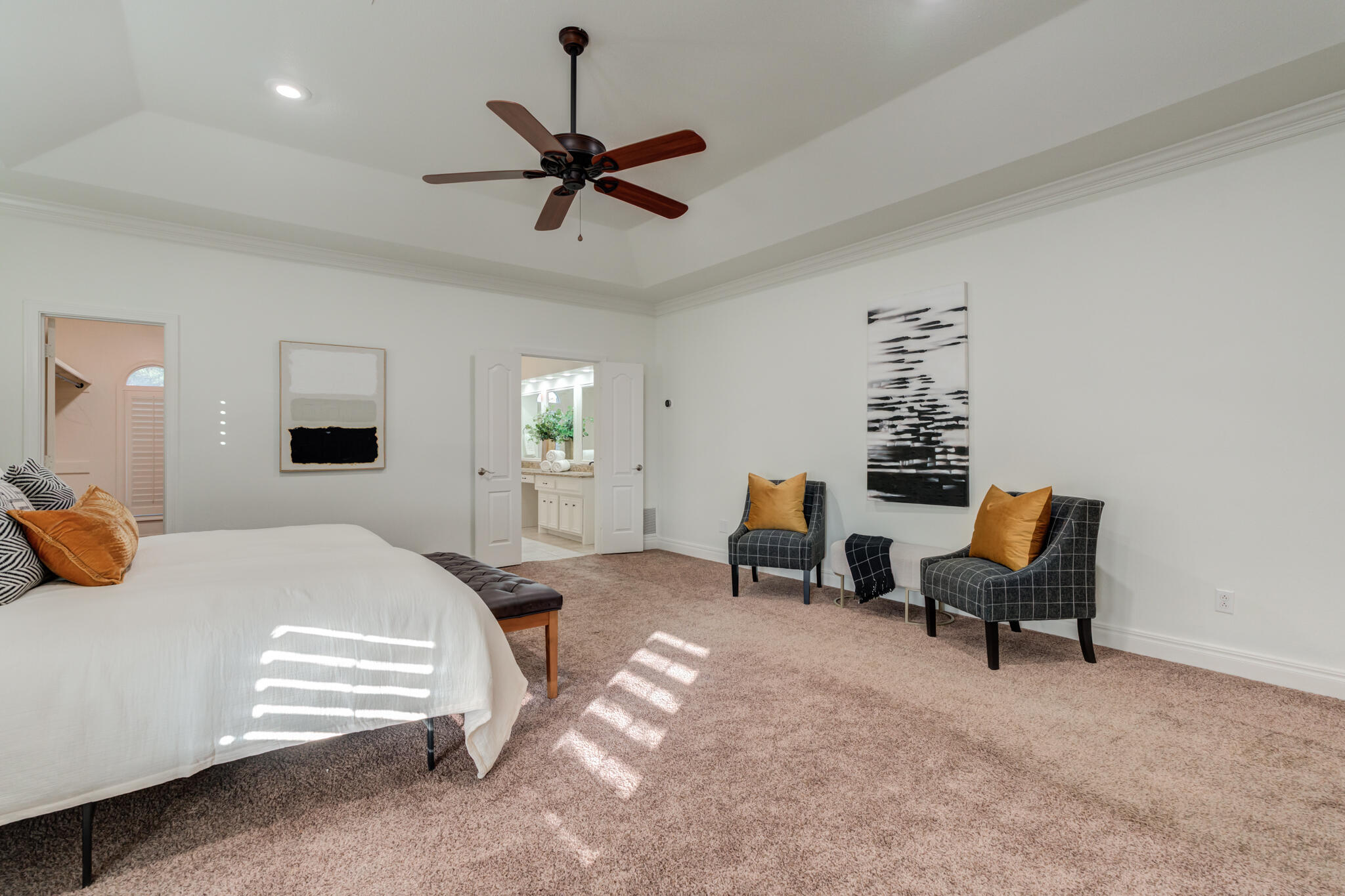 4707 85th Street Lubbock, TX 79424 - Photo 35 of 63 a bedroom with a bed a couch and a window