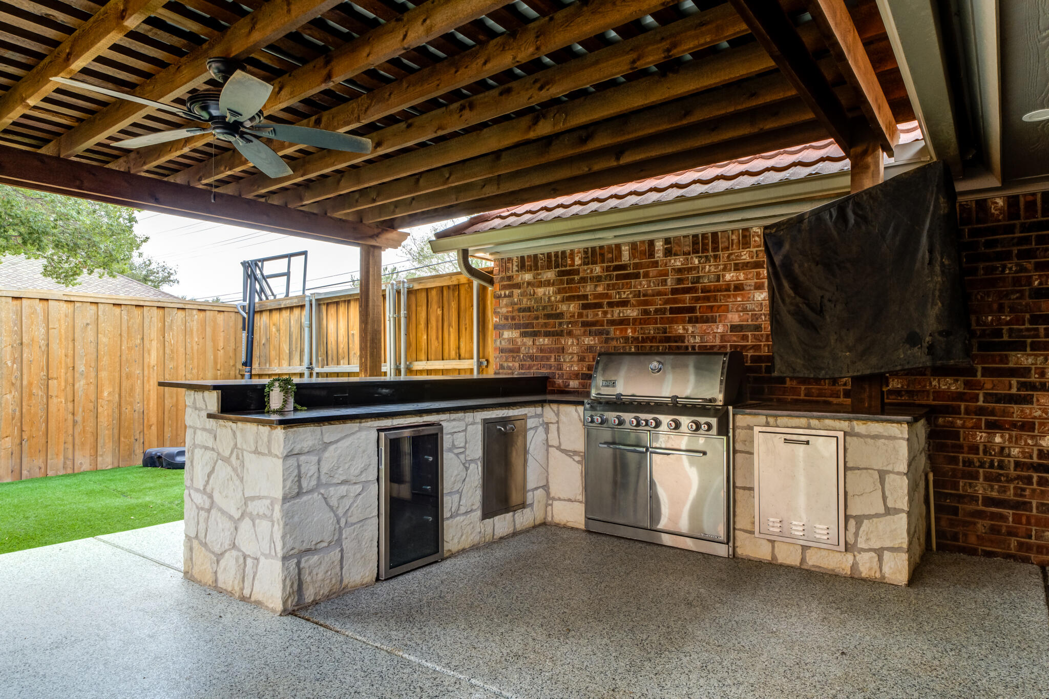 4707 85th Street Lubbock, TX 79424 - Photo 4 of 63 a kitchen with stainless steel appliances granite countertop a stove a sink and dishwasher