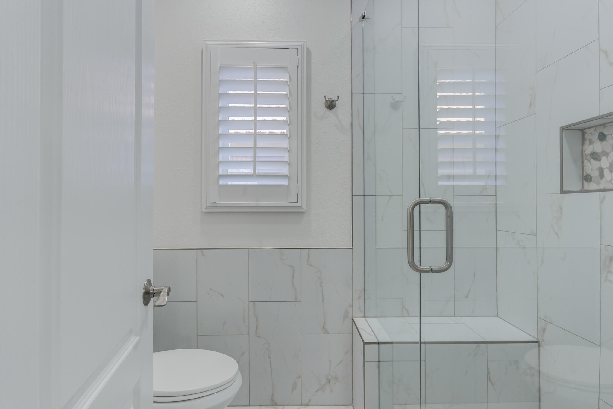 4707 85th Street Lubbock, TX 79424 - Photo 51 of 63 a bathroom with a toilet and shower