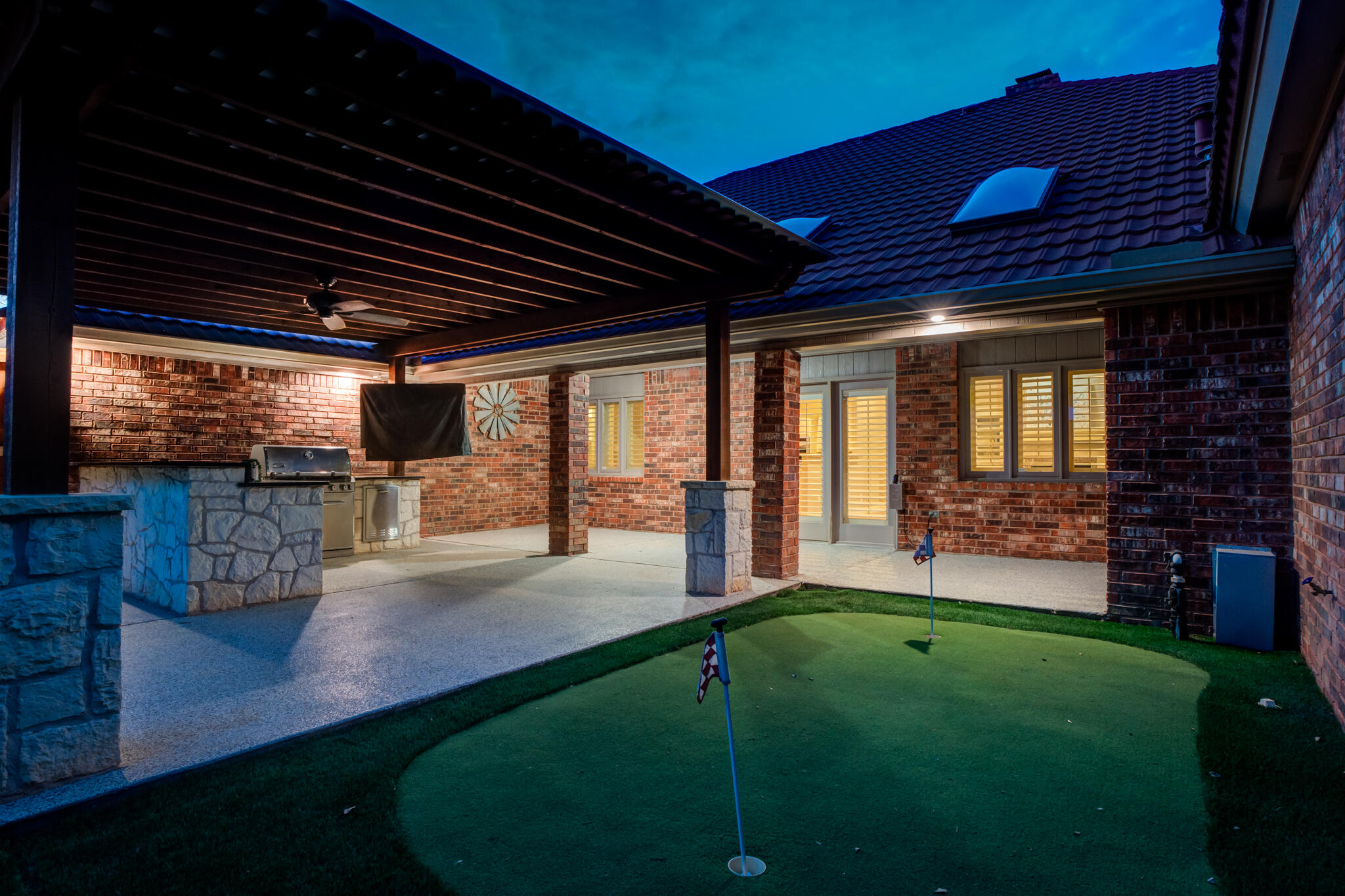 4707 85th Street Lubbock, TX 79424 - Photo 60 of 63 a view of a backyard with table and chairs with wooden floor and roof
