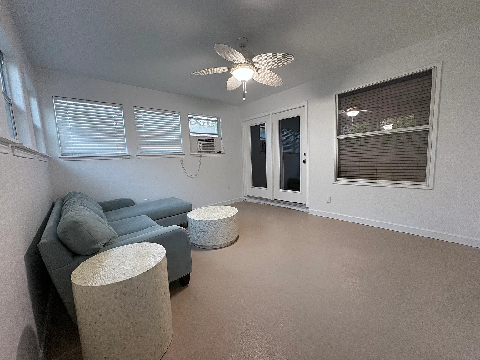 430 Summit Ridge Drive North Point Venture, TX 78645 - Photo 15 of 26 A well-lit sitting area with a ceiling fan offers comfortable relaxation.