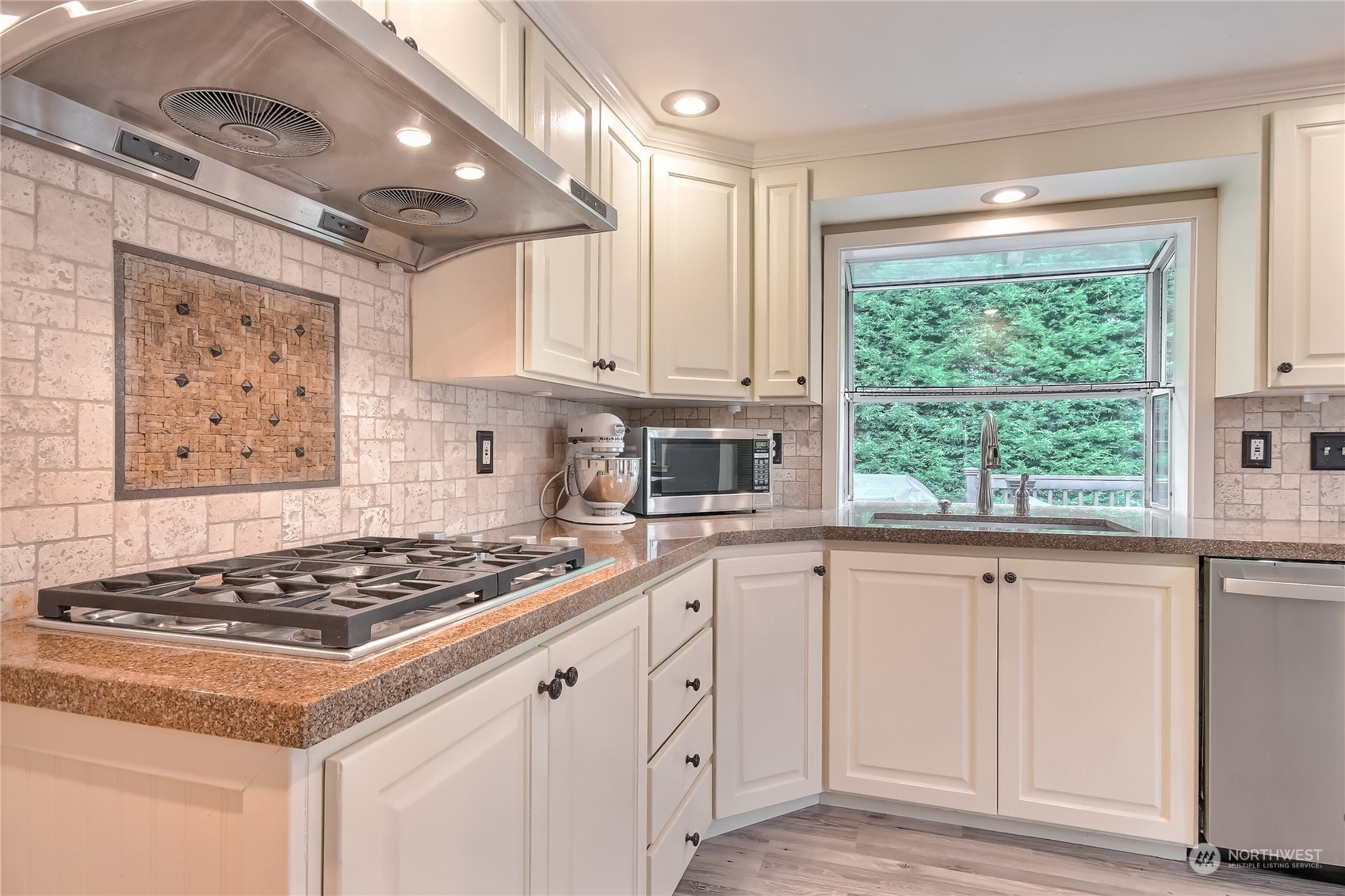 31 213th Street Southwest Bothell, WA 98021 - Photo 13 of 40 a kitchen with white cabinets and stove