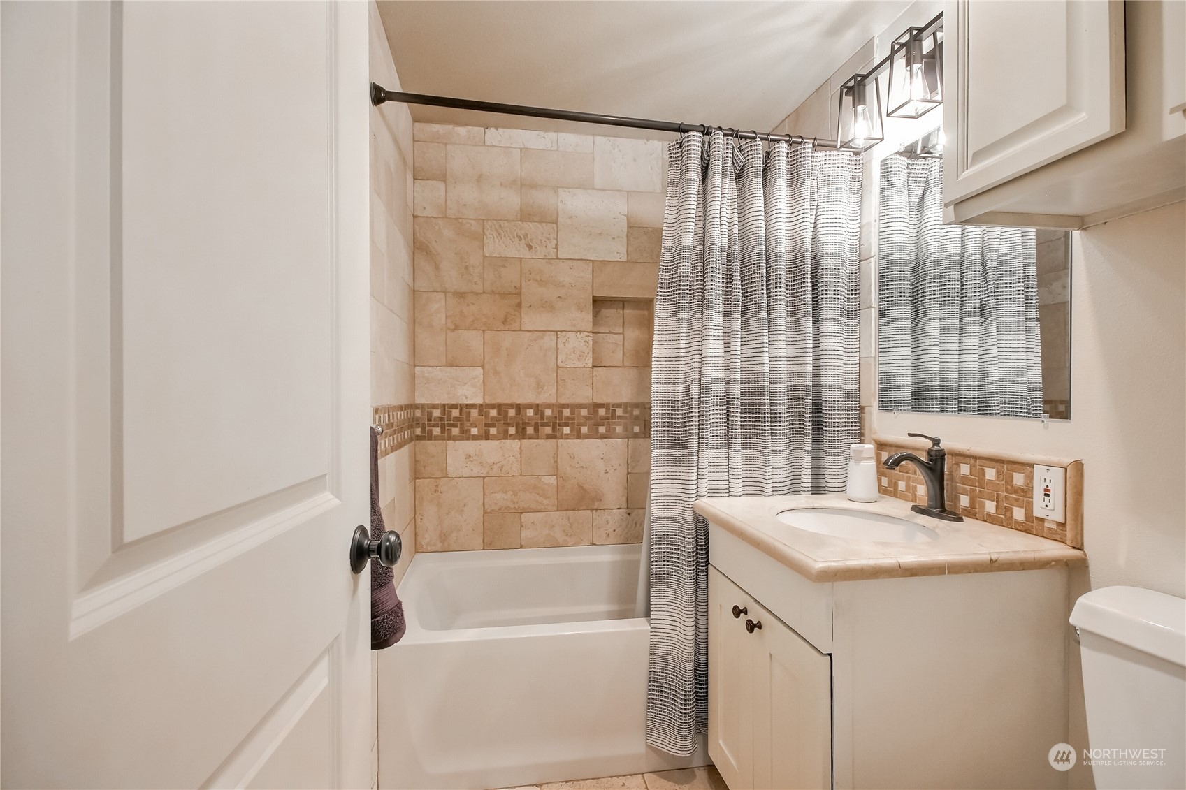 31 213th Street Southwest Bothell, WA 98021 - Photo 15 of 40 a bathroom with a granite countertop sink a toilet and shower