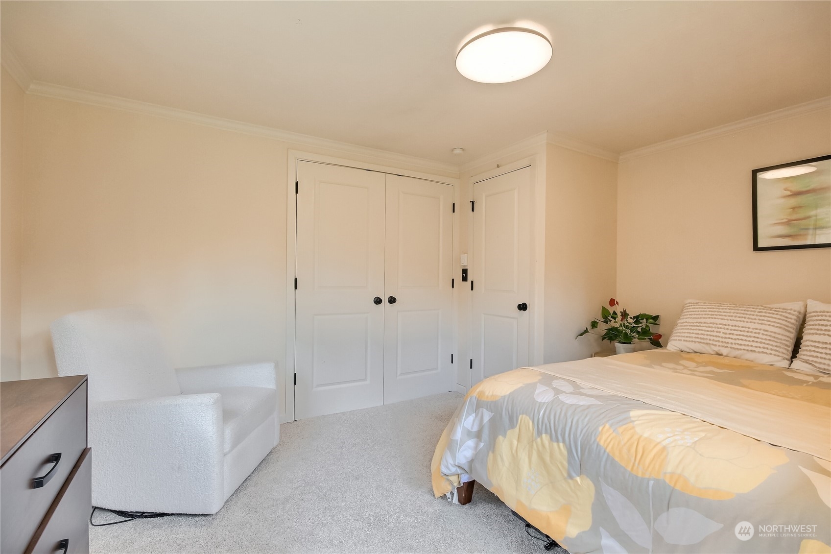 31 213th Street Southwest Bothell, WA 98021 - Photo 18 of 40 a bedroom with a bed and a chandelier