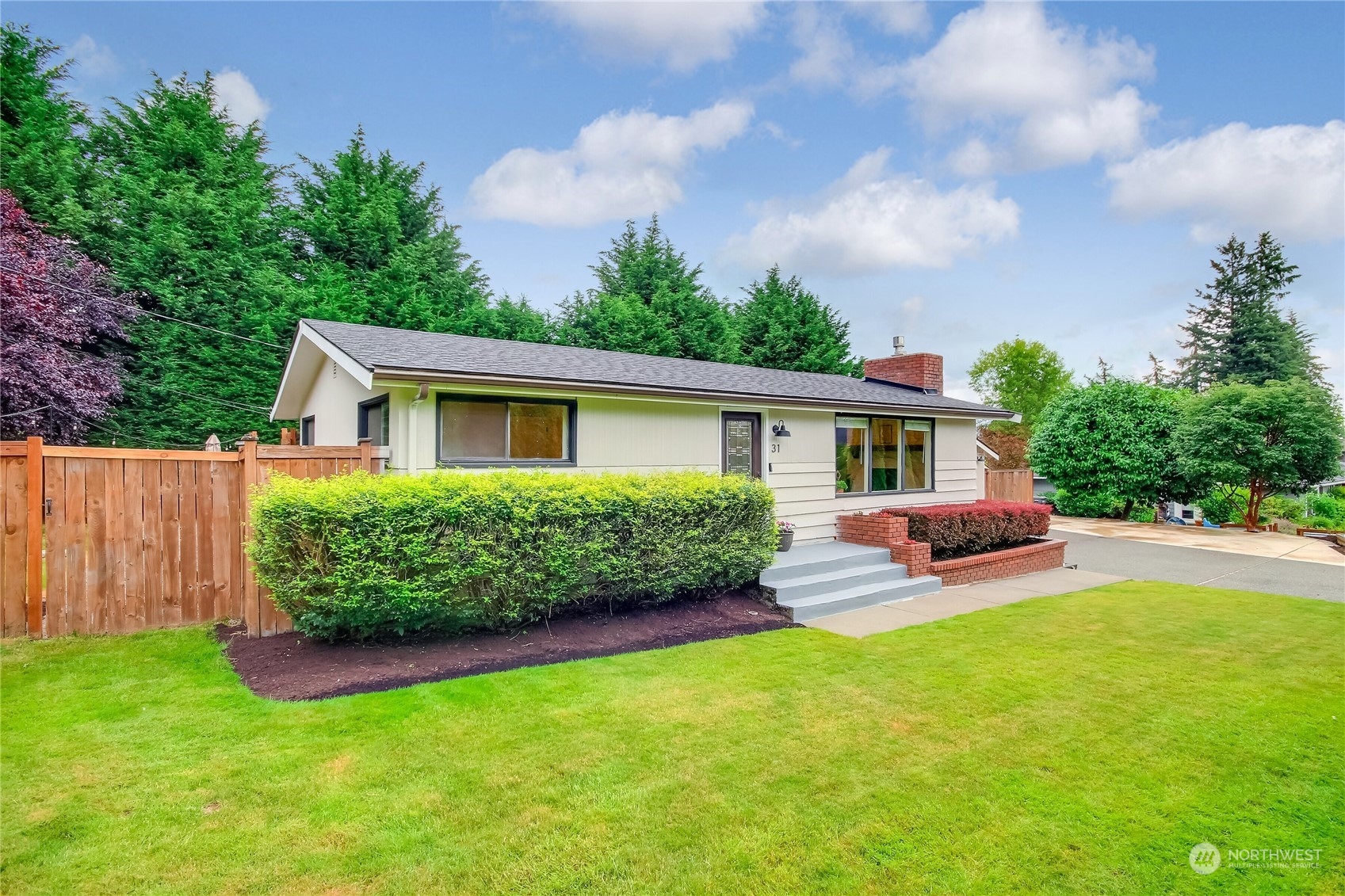 31 213th Street Southwest Bothell, WA 98021 - Photo 2 of 40 a view of a house with a yard and a garden