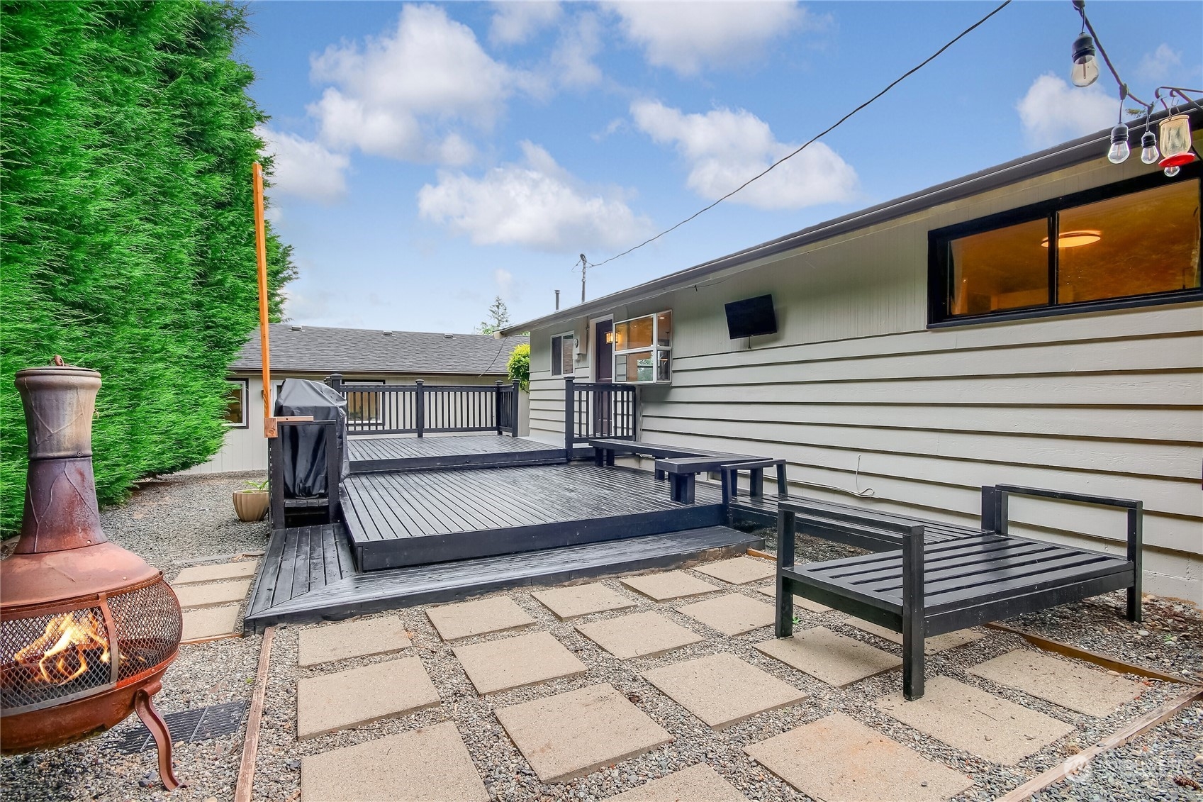 31 213th Street Southwest Bothell, WA 98021 - Photo 24 of 40 a view of a chairs setting in the backyard of the house