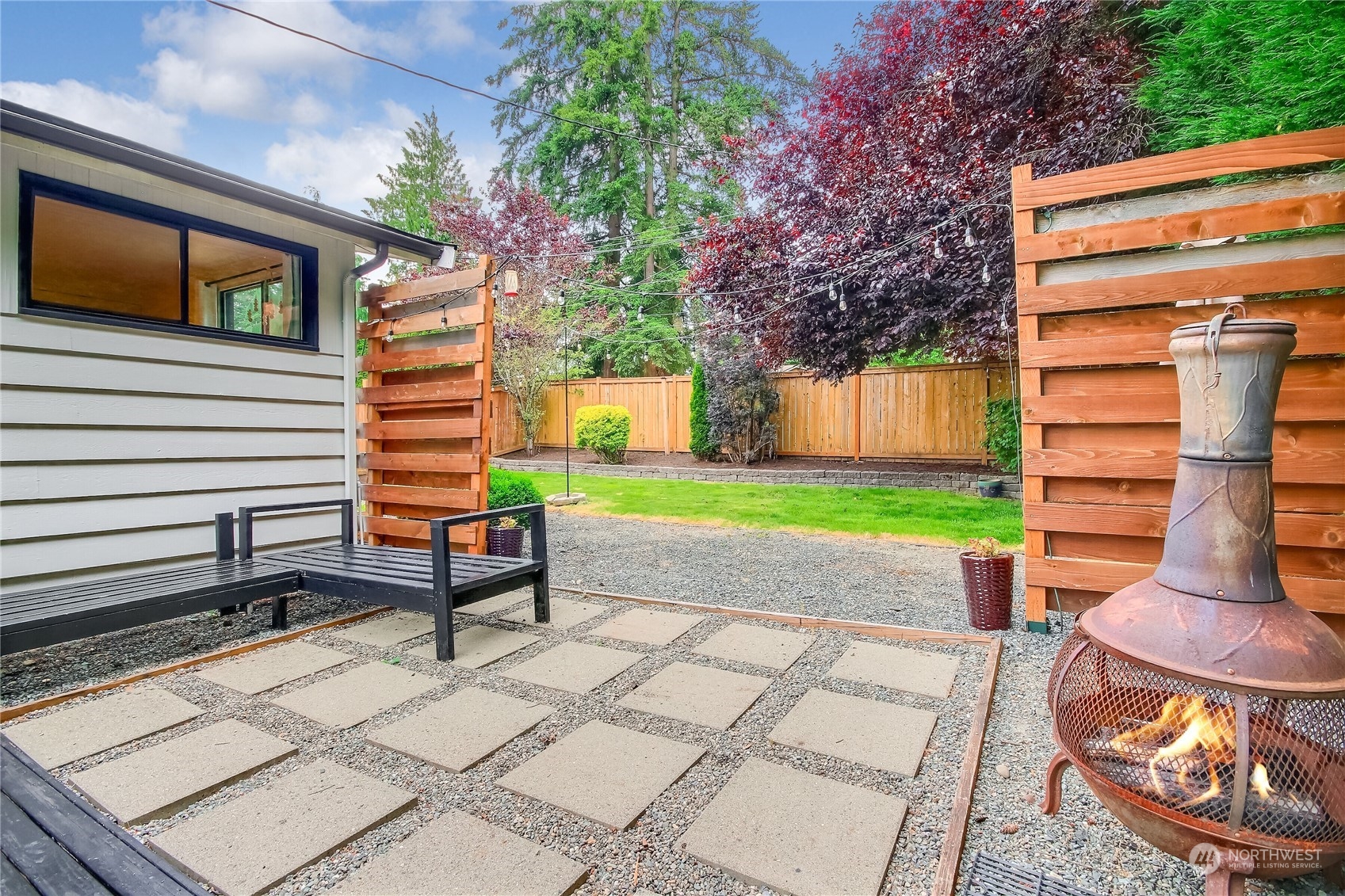 31 213th Street Southwest Bothell, WA 98021 - Photo 25 of 40 a backyard of a house with barbeque oven table and chairs