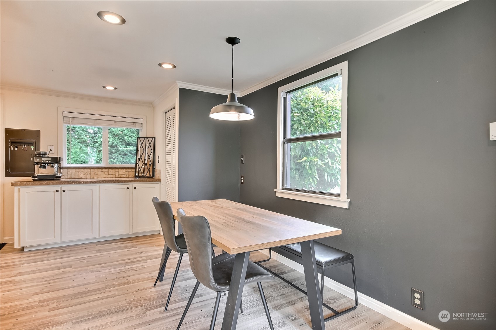 31 213th Street Southwest Bothell, WA 98021 - Photo 8 of 40 a view of a dining room with furniture windows and wooden floor