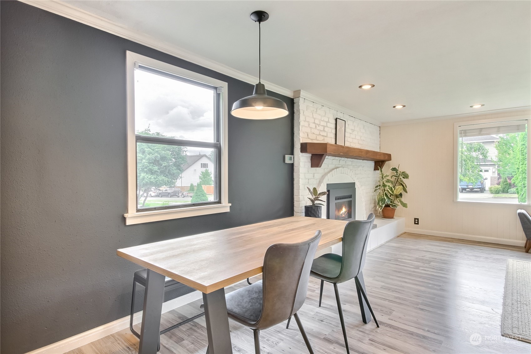 31 213th Street Southwest Bothell, WA 98021 - Photo 9 of 40 a view of a dining room with furniture window and wooden floor