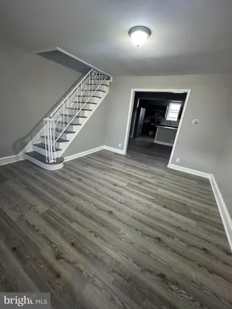 wooden floor in white room with wooden floor