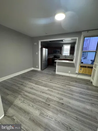 a view of an empty room and fire place