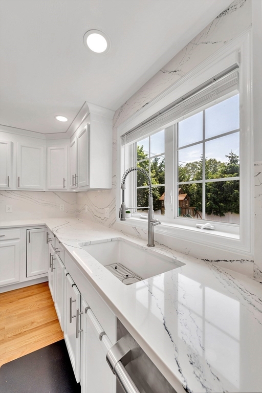 47 Fenwick Circle Methuen, MA 01844 - Photo 12 of 42 a kitchen with a sink and large window