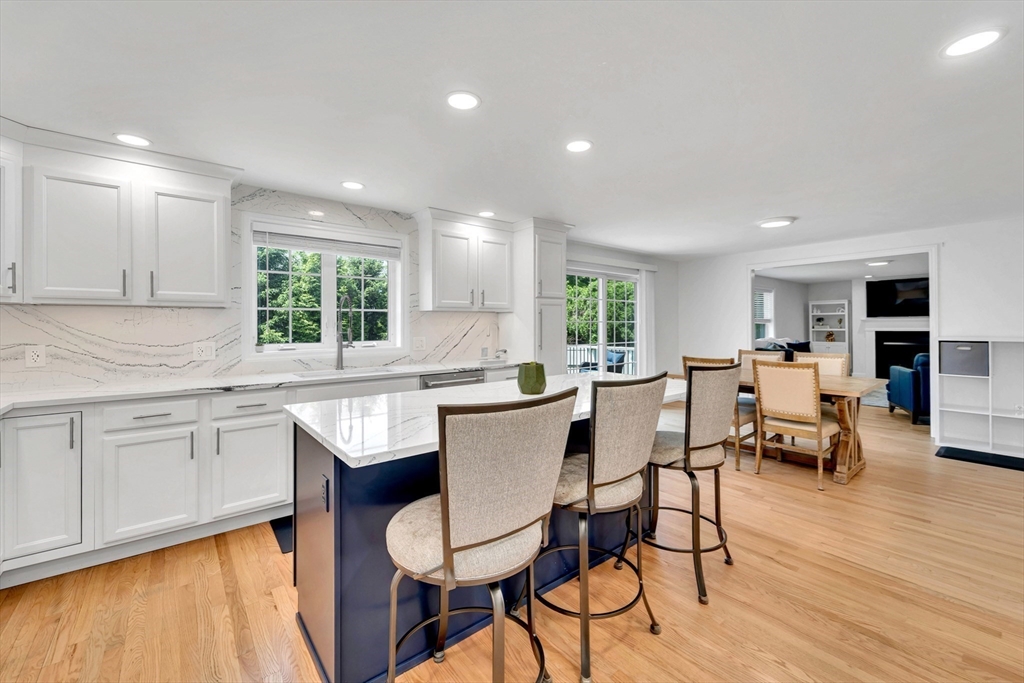 47 Fenwick Circle Methuen, MA 01844 - Photo 14 of 42 a kitchen with a table chairs sink and cabinets