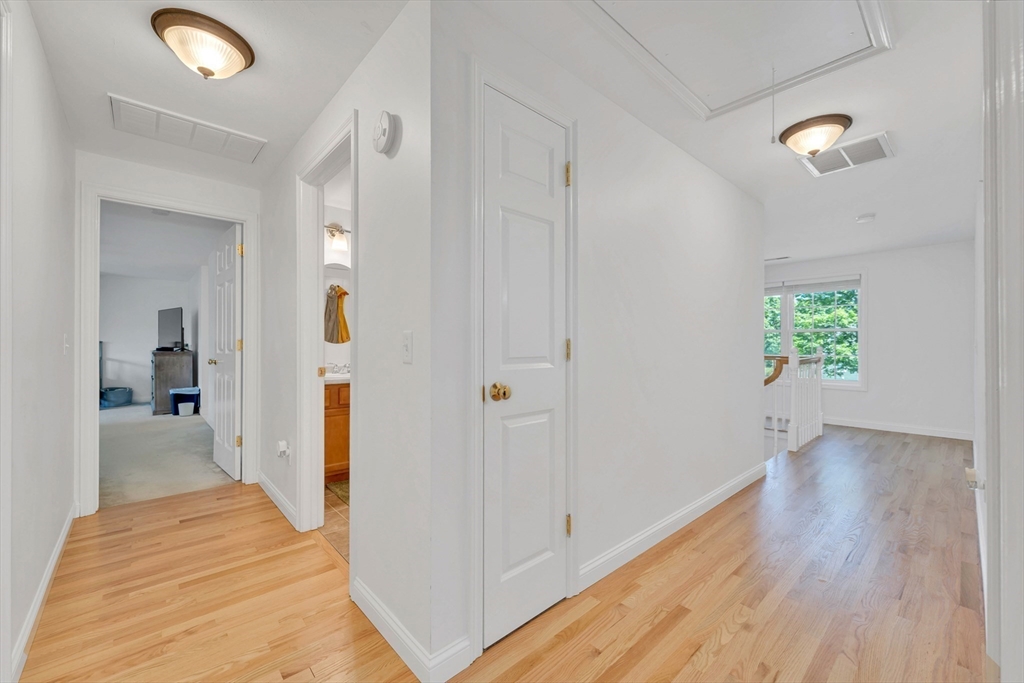 47 Fenwick Circle Methuen, MA 01844 - Photo 22 of 42 a view of a hallway with wooden floor and closet