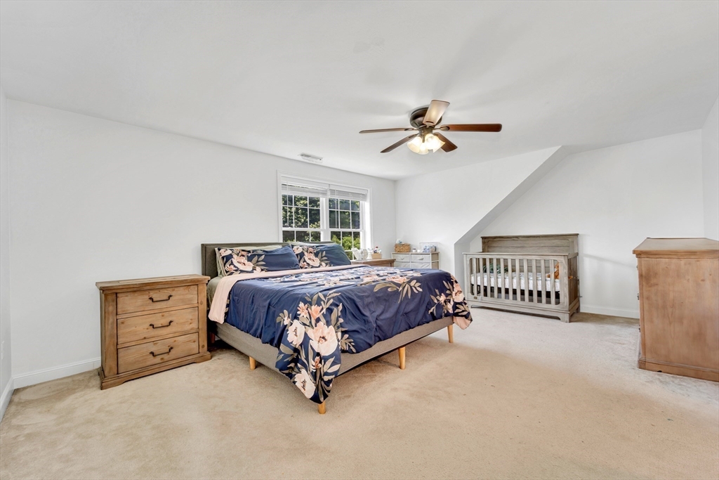 47 Fenwick Circle Methuen, MA 01844 - Photo 23 of 42 a bedroom with a bed and a ceiling fan