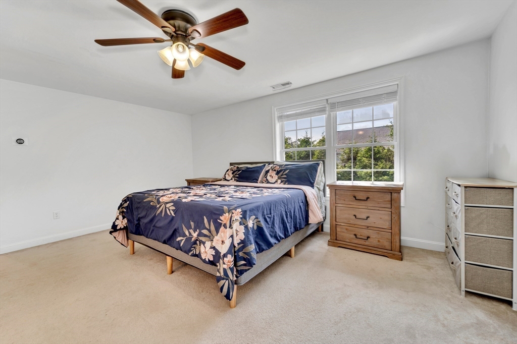 47 Fenwick Circle Methuen, MA 01844 - Photo 24 of 42 a bedroom with a bed dresser and a large window