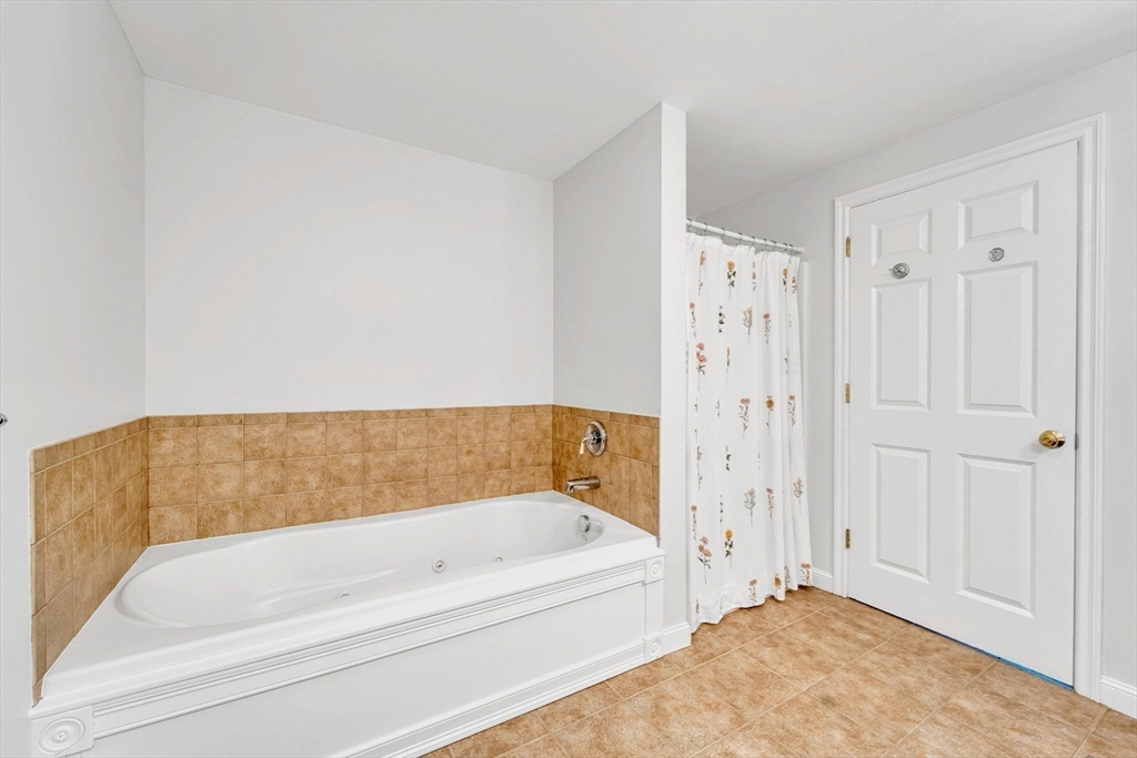 47 Fenwick Circle Methuen, MA 01844 - Photo 26 of 42 a bathroom with a bathtub and a shower