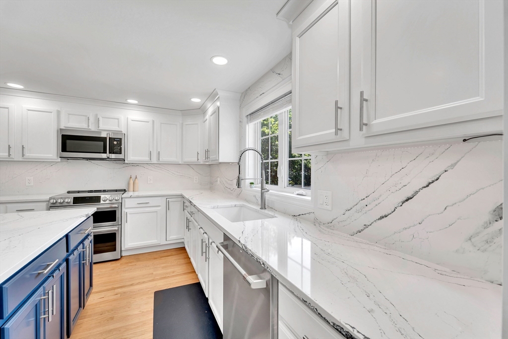 47 Fenwick Circle Methuen, MA 01844 - Photo 3 of 42 a kitchen with stainless steel appliances granite countertop white cabinets sink and stove