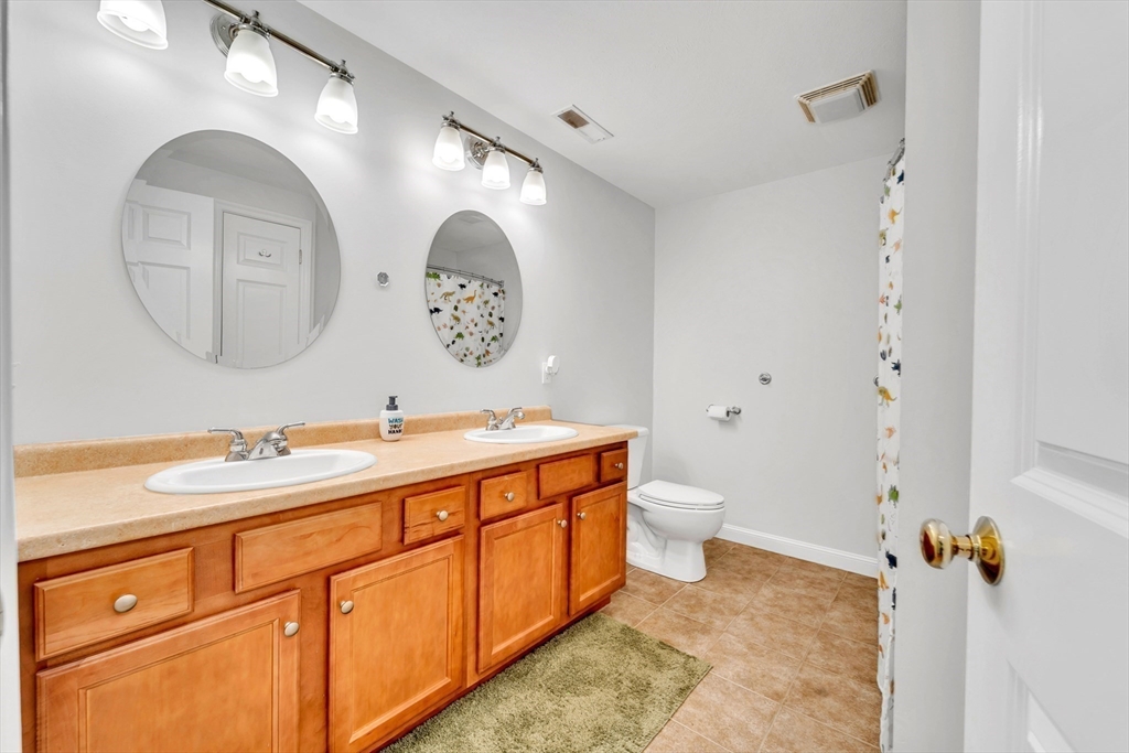 47 Fenwick Circle Methuen, MA 01844 - Photo 34 of 42 a bathroom with a double vanity sink and a mirror