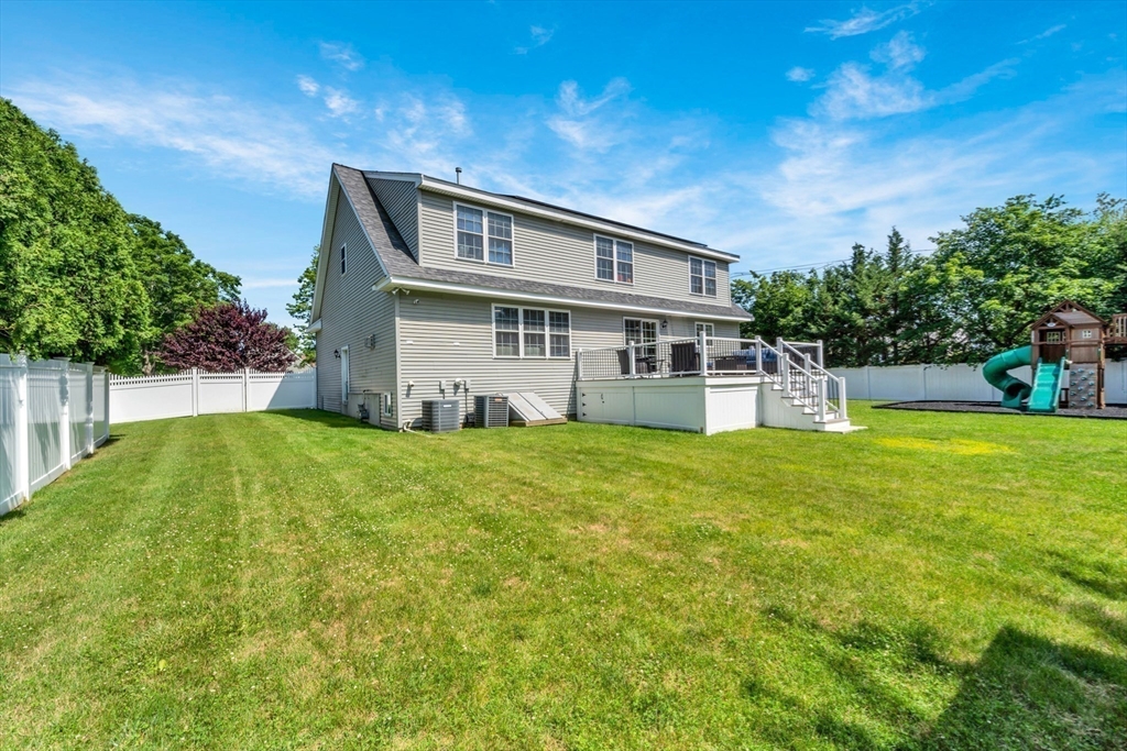47 Fenwick Circle Methuen, MA 01844 - Photo 40 of 42 a view of a house with a yard patio and a garden