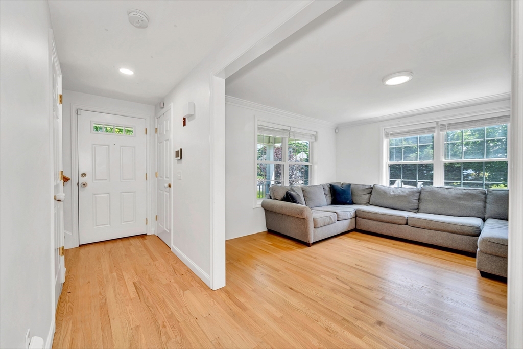 47 Fenwick Circle Methuen, MA 01844 - Photo 7 of 42 a living room with furniture and a wooden floor