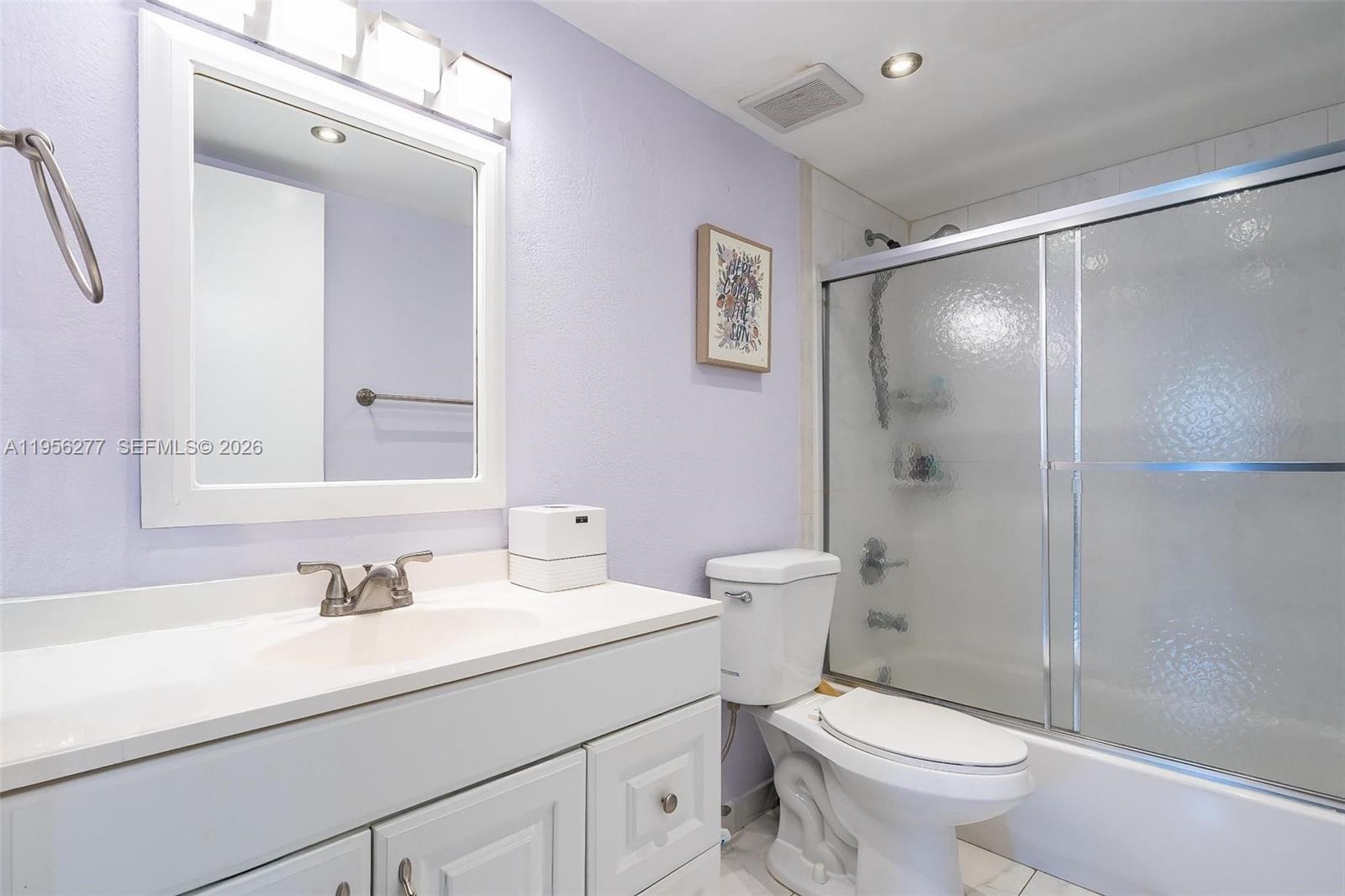 13810 Southwest 112th Street, Unit 102 Miami, FL 33186 - Photo 14 of 28 a bathroom with a sink toilet and shower
