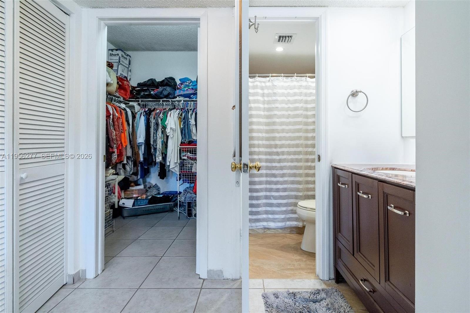 13810 Southwest 112th Street, Unit 102 Miami, FL 33186 - Photo 19 of 28 a view of a gallery door and living room