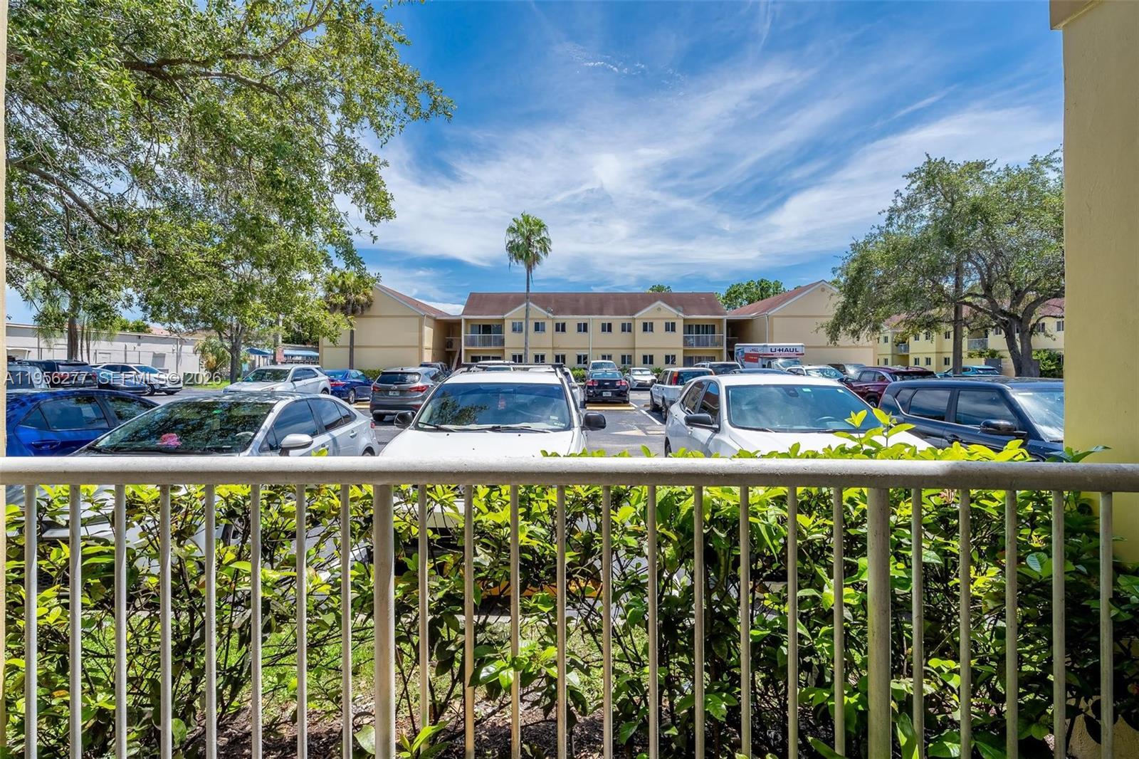 13810 Southwest 112th Street, Unit 102 Miami, FL 33186 - Photo 27 of 28 a swimming pool with outdoor seating and yard