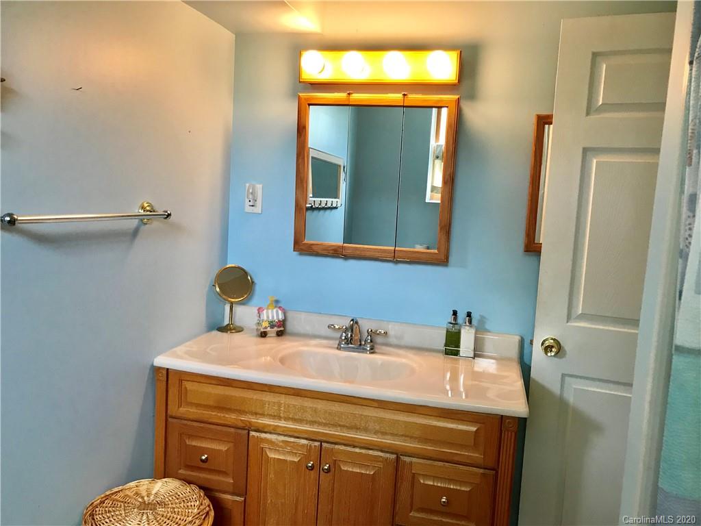 917 Edwards St Extension Rutherfordton, NC 28139 - Photo 22 of 23 a bathroom with a sink a mirror and a toilet