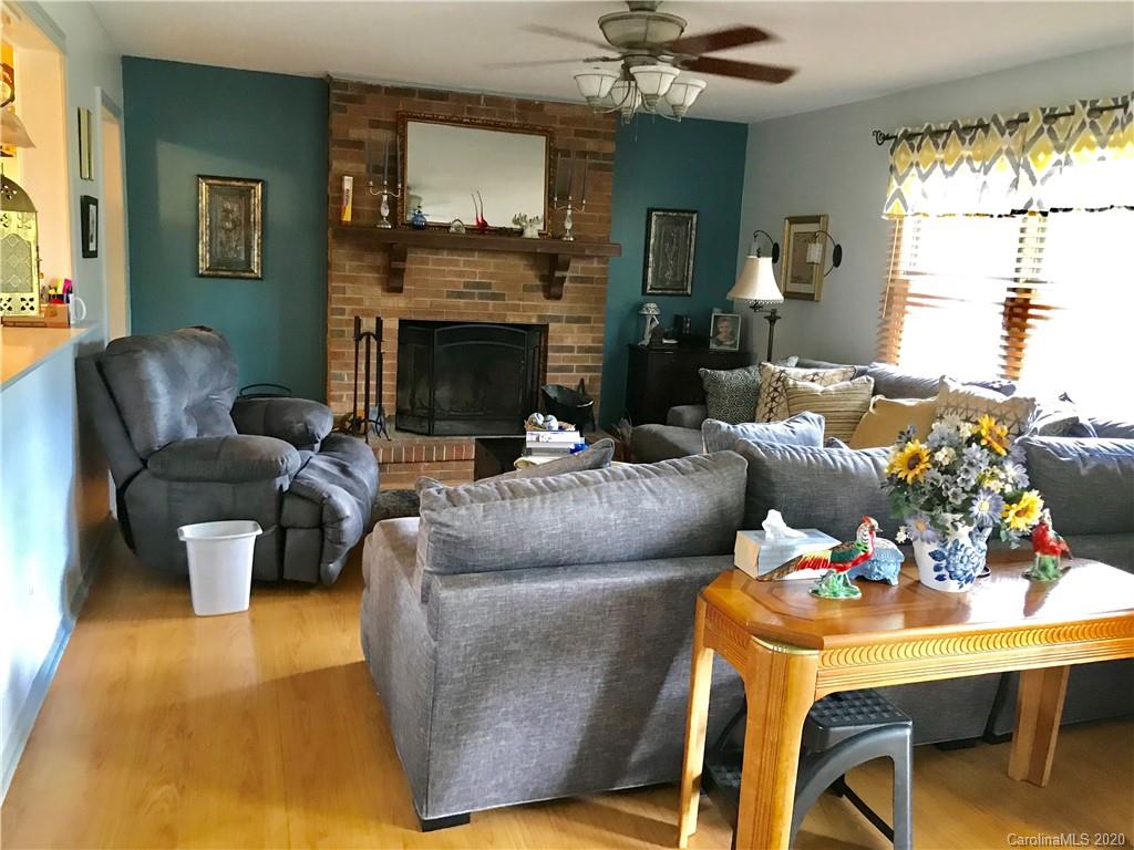 917 Edwards St Extension Rutherfordton, NC 28139 - Photo 7 of 23 a living room with furniture and a fireplace