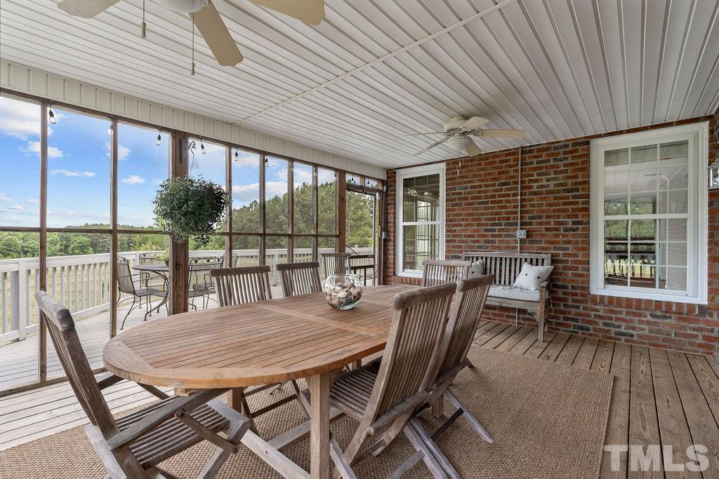 1566 Pope Road Creedmoor, NC 27522 - Photo 54 of 76 a view of a dining room with furniture window and outside view