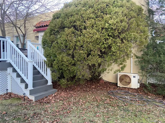 a backyard of a house with table and chairs