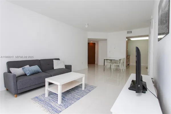 a workspace with wooden floor and a bathroom