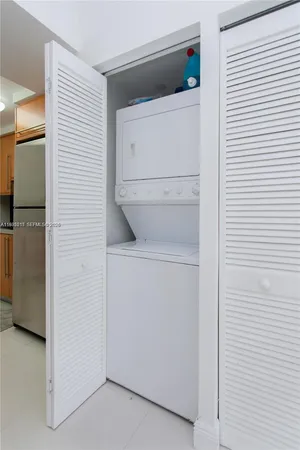 a living room with furniture a fireplace and a table