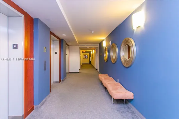 a view of a building with backyard and sitting area