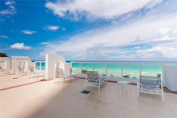 a room with gym equipment and large windows