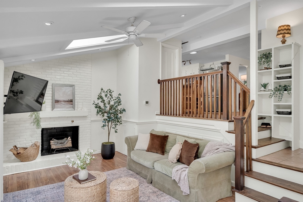 357 Lincoln Street Lexington, MA 02421 - Photo 15 of 29 a living room with furniture and a fireplace