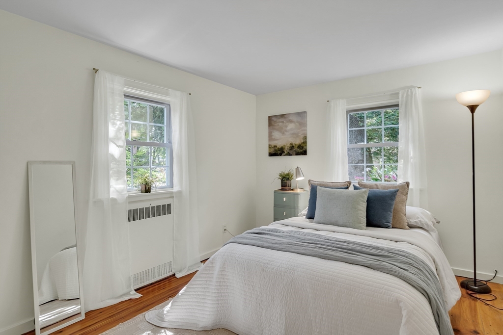 357 Lincoln Street Lexington, MA 02421 - Photo 17 of 29 a bedroom with bed and window