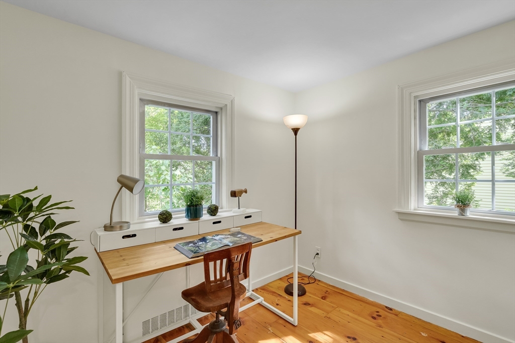 357 Lincoln Street Lexington, MA 02421 - Photo 19 of 29 a view of a workspace with a window and wooden floor
