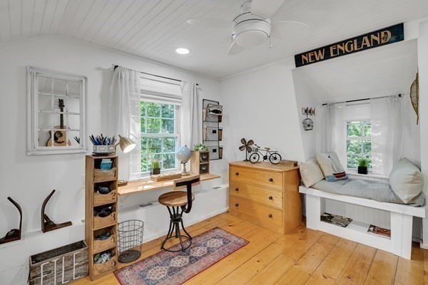 357 Lincoln Street Lexington, MA 02421 - Photo 23 of 29 a living room with furniture windows and a potted plant