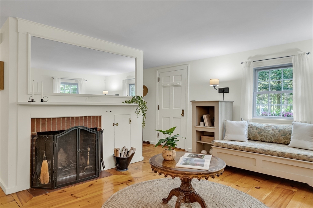 357 Lincoln Street Lexington, MA 02421 - Photo 3 of 29 a living room with furniture and a fireplace