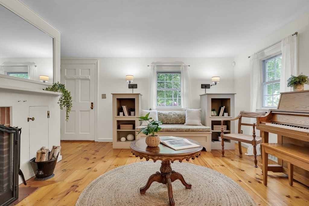 357 Lincoln Street Lexington, MA 02421 - Photo 5 of 29 a living room with furniture and a fireplace