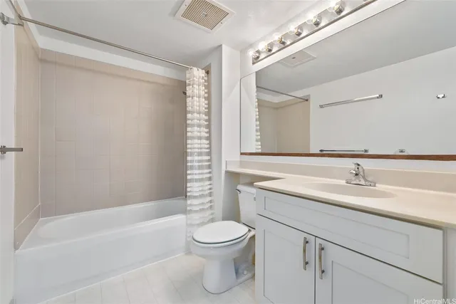 a bathroom with a toilet a sink a mirror a bathtub and shower