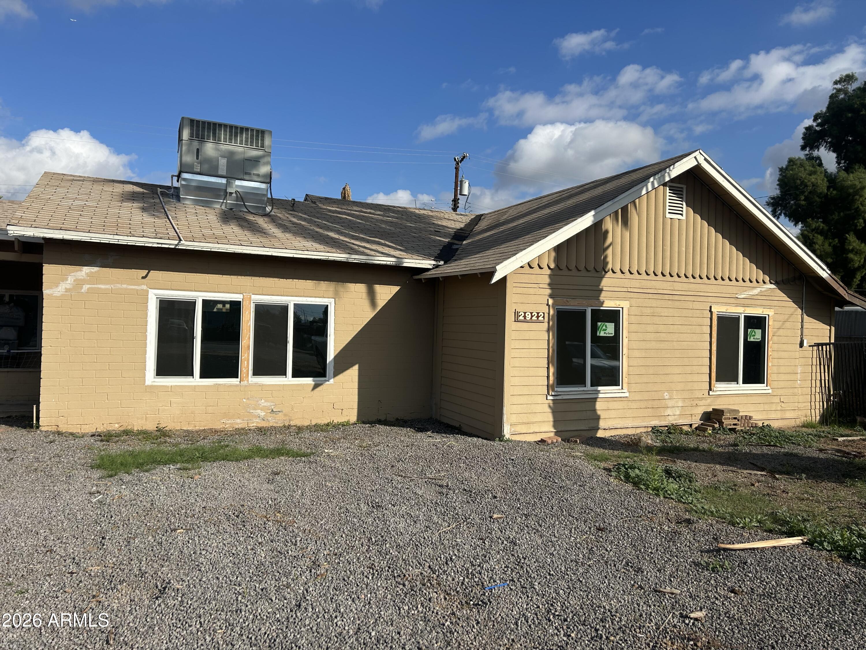 a front view of a house with yard