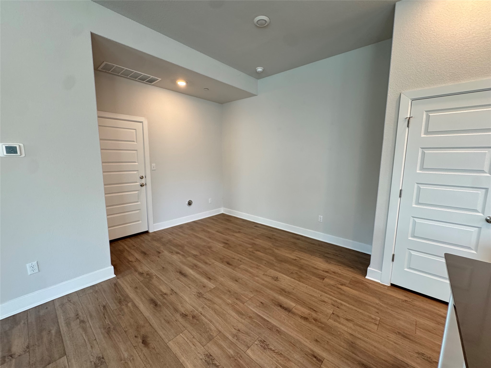 3000 Chisholm Trail Road, Unit 91 Round Rock, TX 78681 - Photo 3 of 27 A versatile utility area with durable wood flooring and clean, functional design.