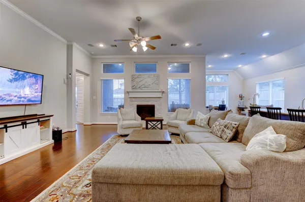 a view of a dining room with furniture and wooden floor