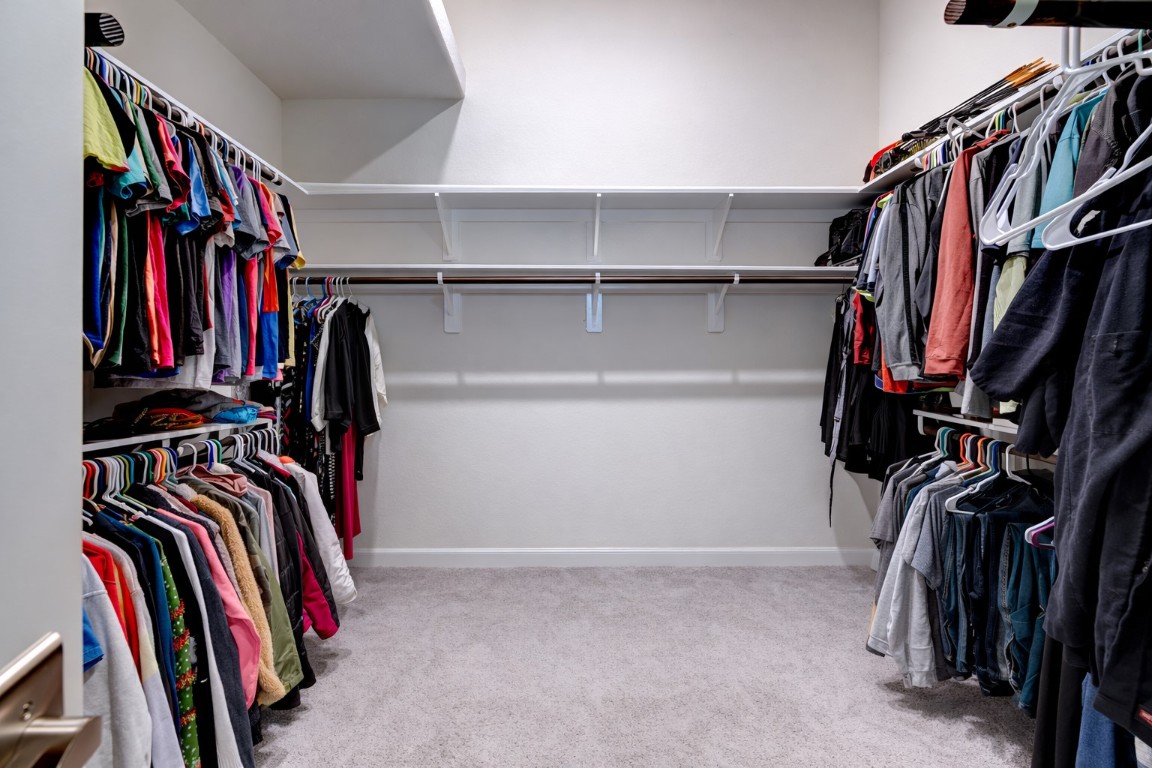 6242 Avon Landing Lane Spring, TX 77379 - Photo 25 of 42 a view of walk in closet with clothes