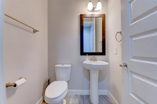 a front view of house with a garden