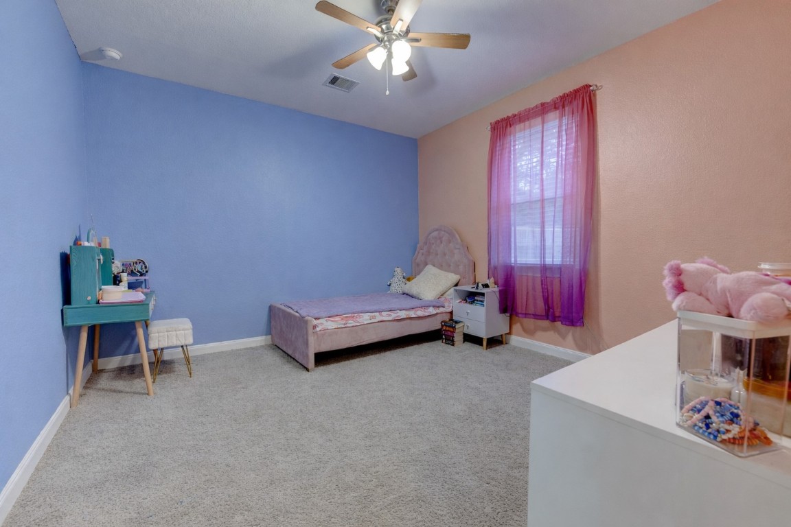6242 Avon Landing Lane Spring, TX 77379 - Photo 27 of 42 a living room with furniture and a chandelier